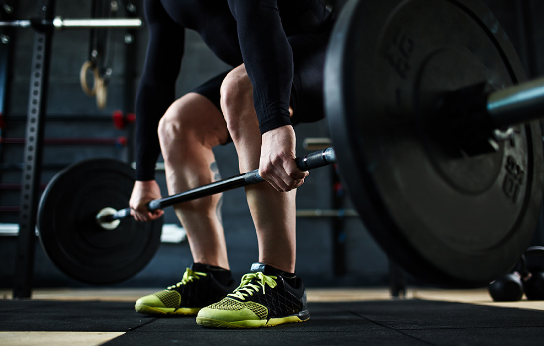 man lifting weights